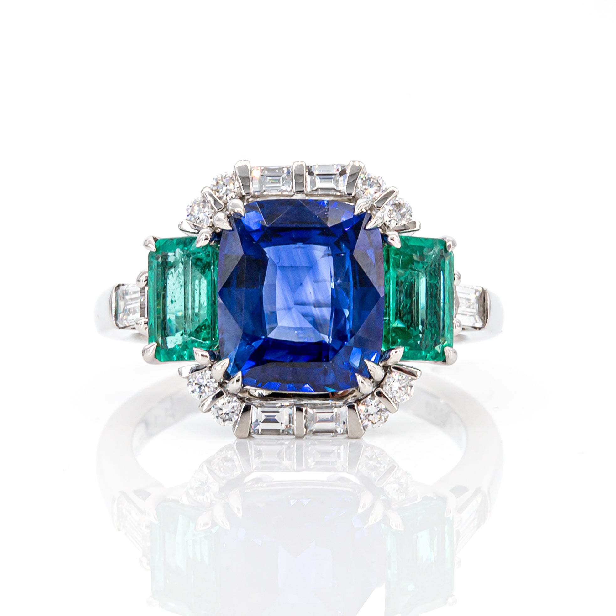 Top view of 3.06ct blue sapphire and 1.145ct emerald diamond interchangeable ring in platinum