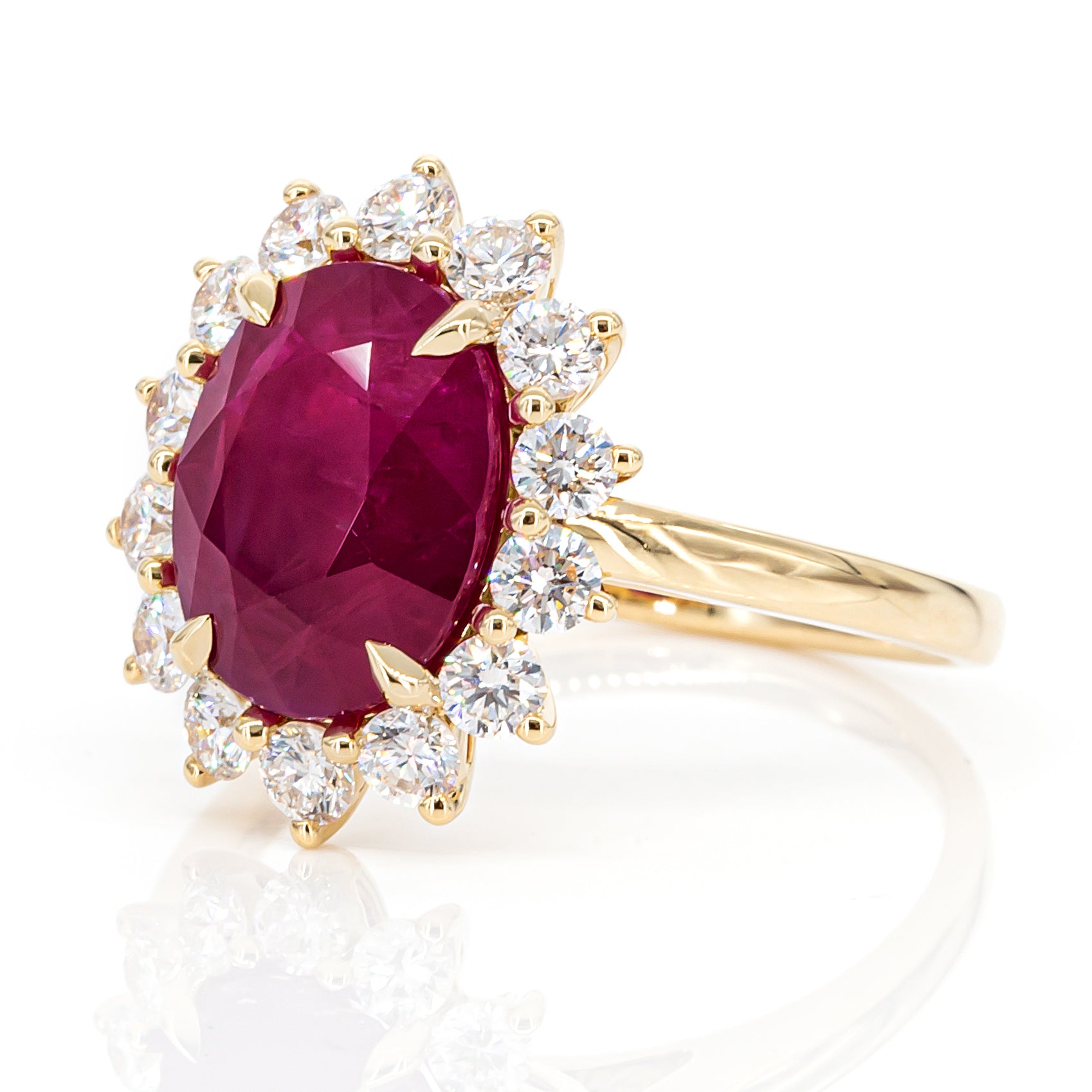 Angled side view of 4.01ct pinkish-red ruby diamond ring in 18K yellow gold, IGI certified, luxury statement design with sparkling diamonds