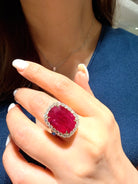 “15.45-carat intense purplish-red oval Ruby diamond ring set in 18K yellow gold on hand