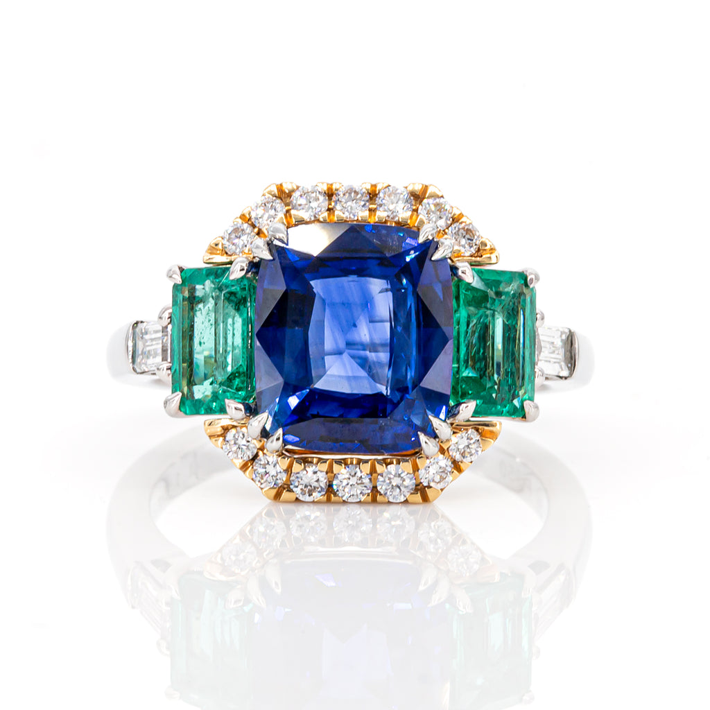 Top view of 3.06ct blue sapphire and 1.145ct emerald diamond interchangeable ring in platinum and yellow gold halo