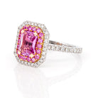 Angled shot of pink sapphire diamond ring highlighting sparkle and craftsmanship