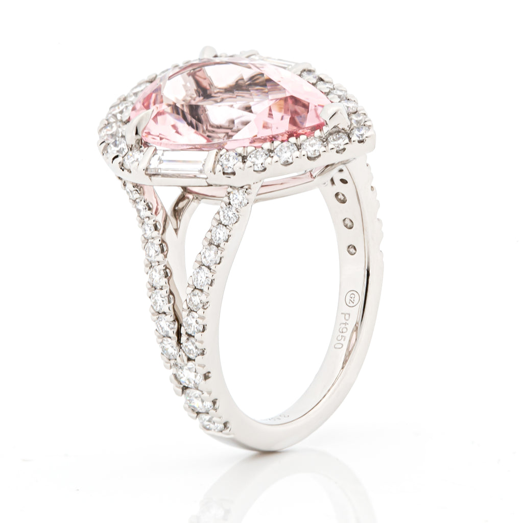 Angled side perspective of morganite and diamond halo ring in PT950 platinum