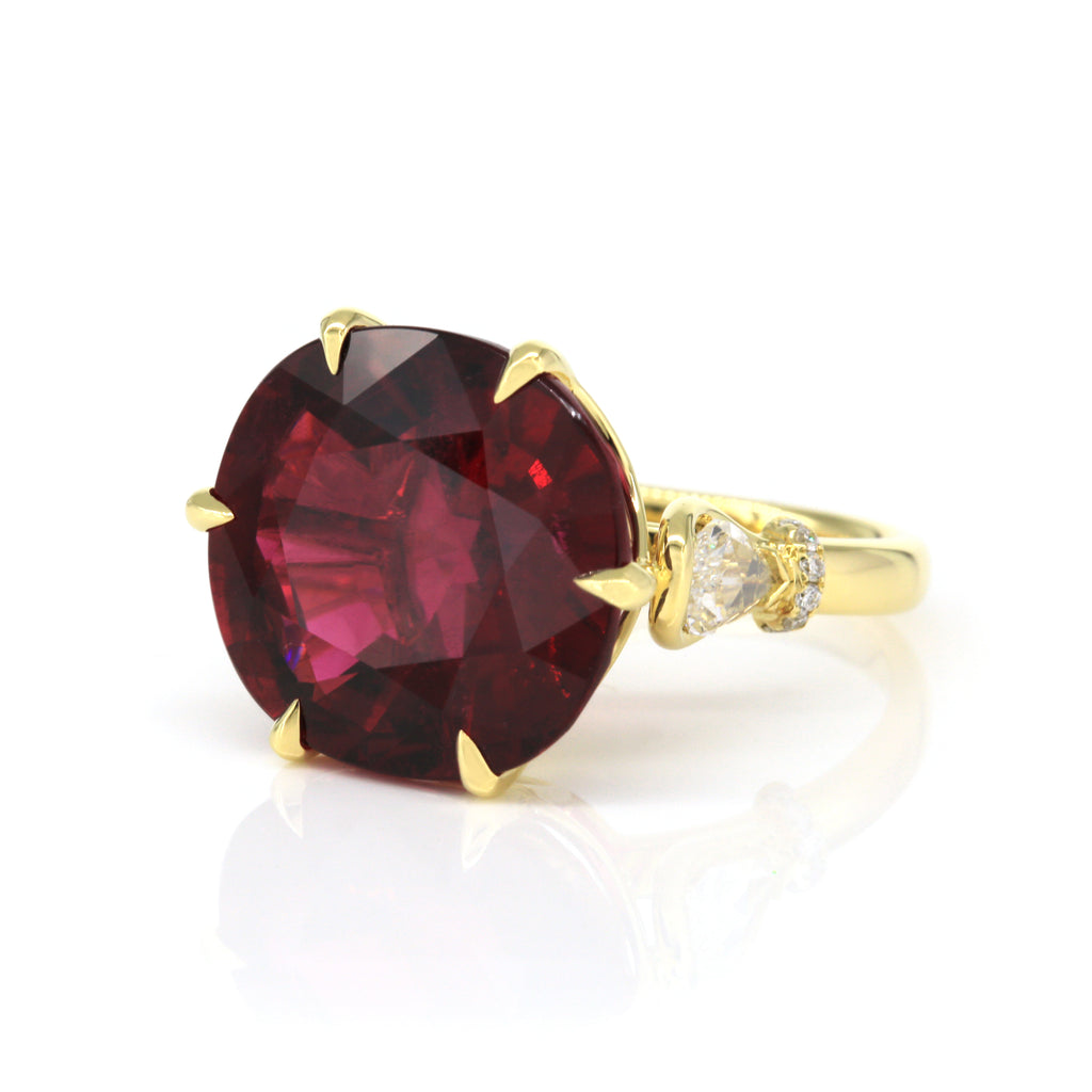 Angled perspective of rubellite and diamond ring in 18K yellow gold
