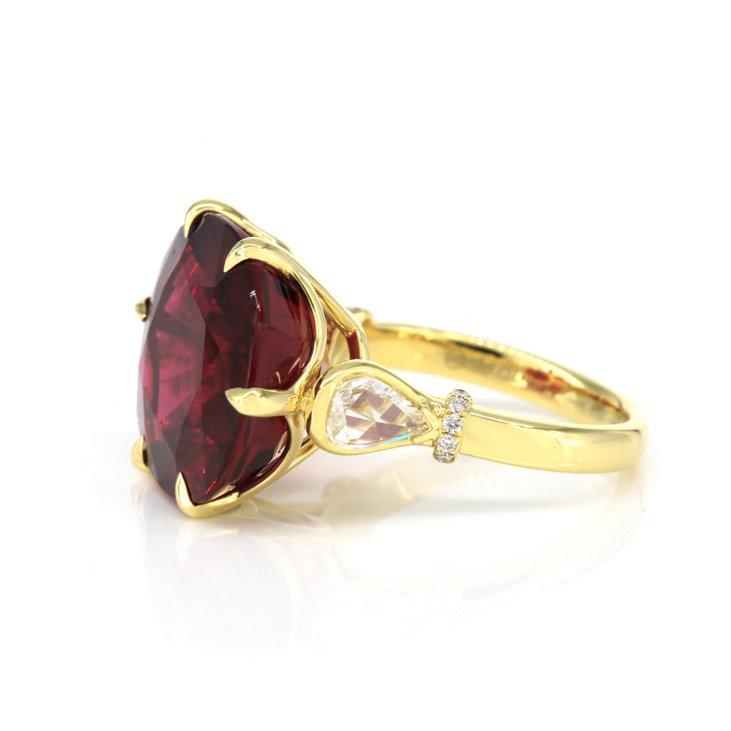 Side view of 15.67ct rubellite and diamond ring in 18K yellow gold