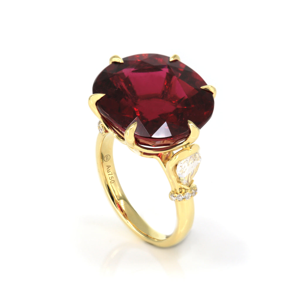 Angled perspective of rubellite and diamond ring in 18K yellow gold