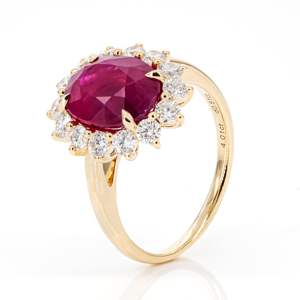 Angled view of 4.01ct pinkish-red ruby diamond ring in 18K yellow gold, IGI certified, luxury statement design with sparkling diamonds